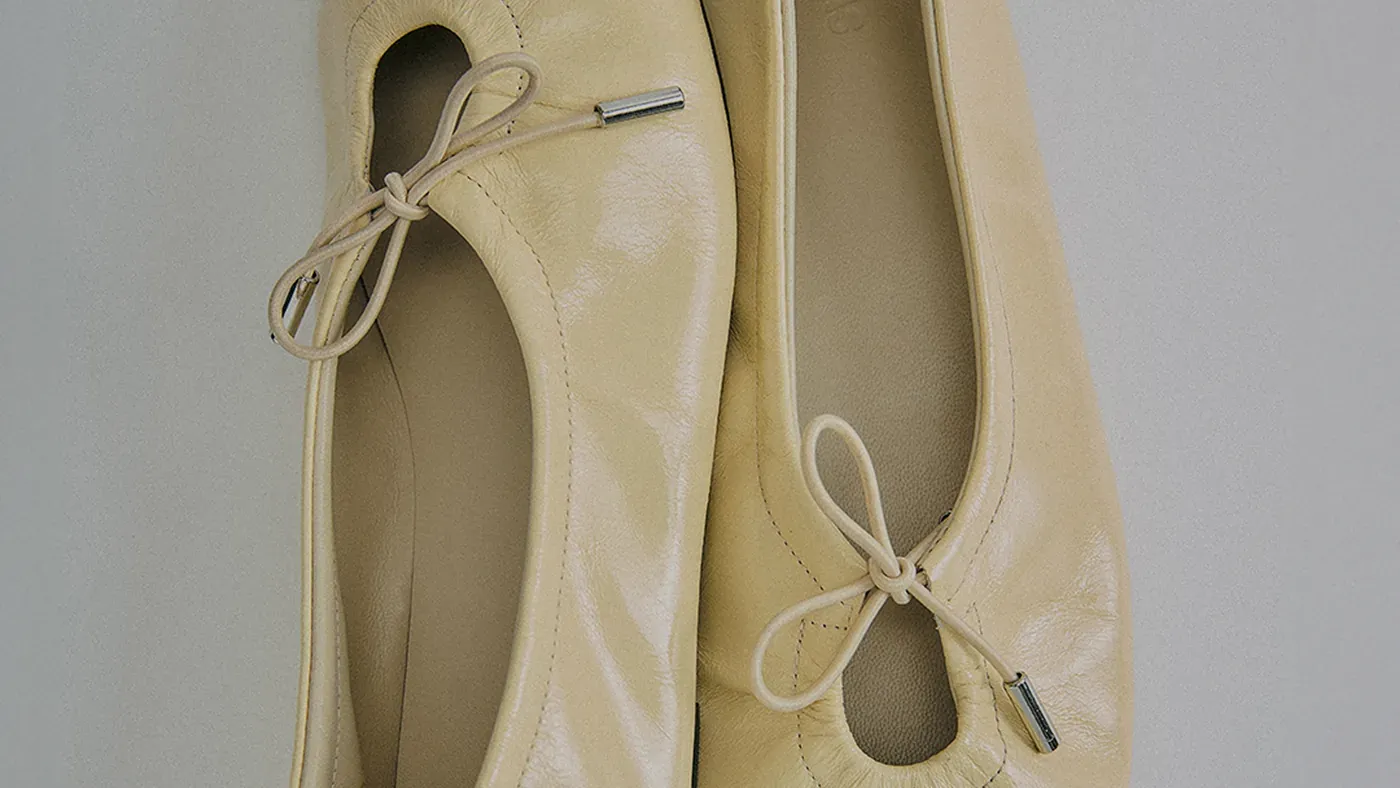 A pair of cream leather ballet flats